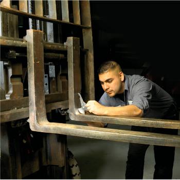 Fork Sale - technician inspecting a fork