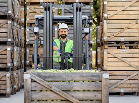 CAT forklift unloading produce