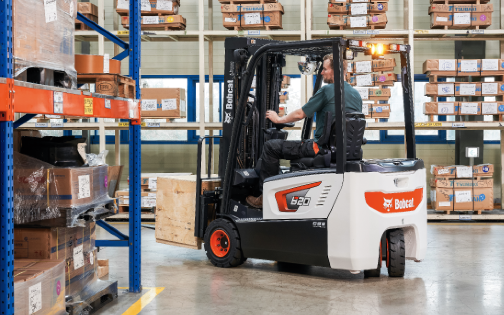 Bobcat forklift turning in warehouse