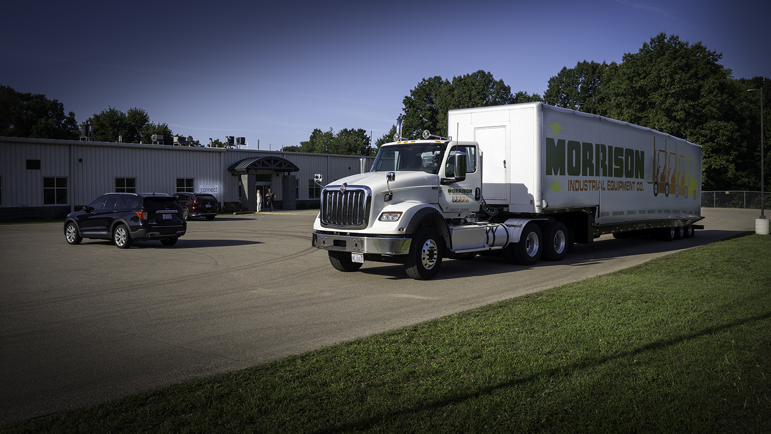 Morrison delivering a forklift to the non-profit organization North Kent Connect